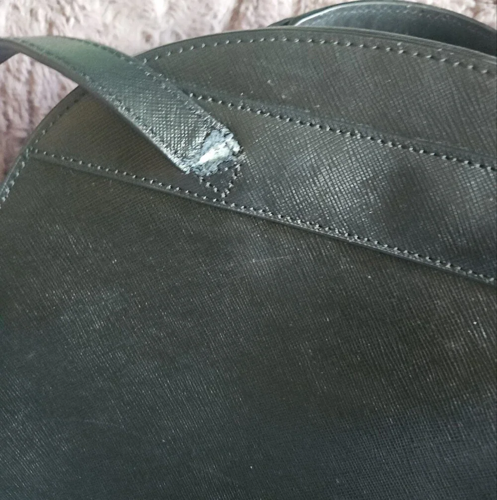 AS-IS Kate Spade black leather backpack LEFT STRAP AT THE TOP TORN. STILL NEW
